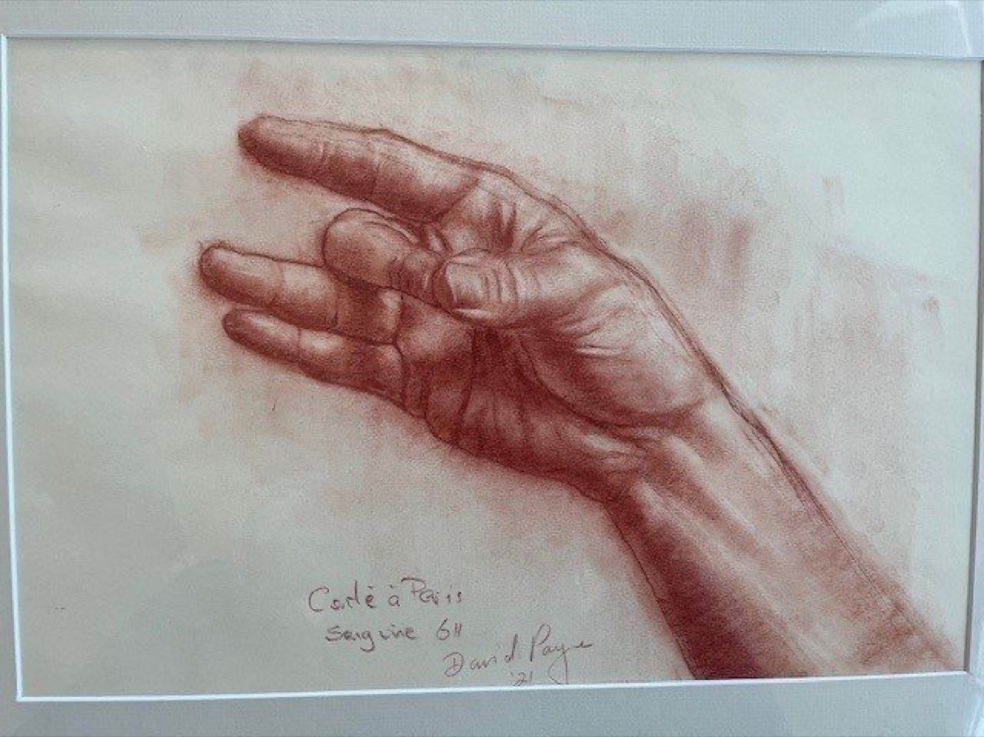 Sanguine chalk study of a hand, drawn in Paris